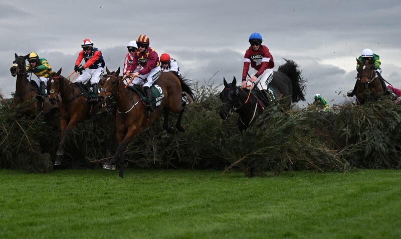 Paul Townend (right) on I Am Maximus rides from behind to win ahead of second placed Jack Kennedy on Delta Work (2R) and third placed jockey Rachael Blackmore on Minella Indo (4L). Photograph: Oli Scarff/AFP via Getty Images