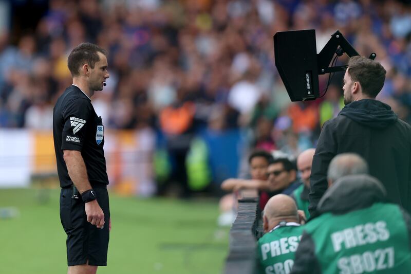 Another match, another screen test for a referee, this time Jarred Gillet during last month's Chelsea-Aston Villa match at Stamford Bridge. Photograph: Ben Hoskins/Getty Images