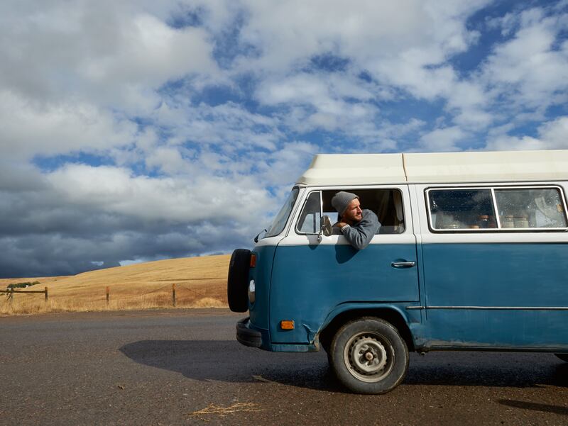 Nash Finley in his 1978 VW van, in which he and his partner, Kim, live, spending most of their time in the mountains of Montana. Photograph: Sian Richards