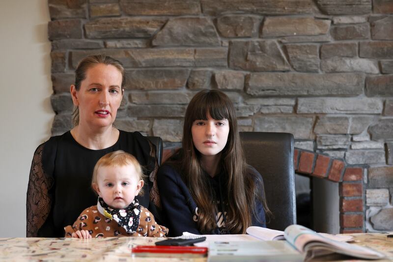 Caroline Ryan Carpenter with her daughters Caoimhe (13) and Isabella (1) at home in Co Kildare. Caroline has had to send Caoimhe to boarding school in Co Tipperary due to a shortage of places in local secondary schools. Photograph: Laura Hutton