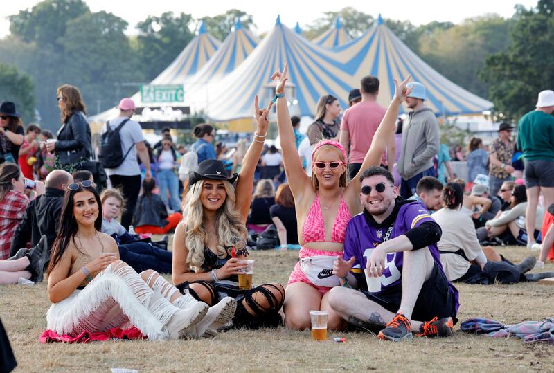 Alisha Clarke, Megan Molloy and Tess Shultz and Eoin Kelly from Galway  prepare to watch the Coronas.  Photograph: Alan Betson / The Irish Times


