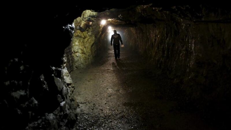 A man walks through a tunnel, part of the Nazi Germany “Riese” construction project, near an area where a Nazi train is believed to be, in Walim near Walbrzych, southwestern Poland. Photograph: Reuters