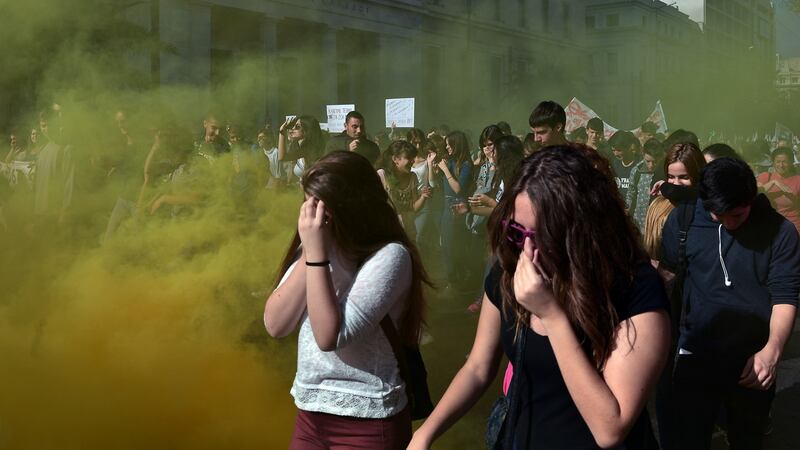 Police used tear gas during a huge demonstration as part of a 24-hour general strike in Athens. Photograph: Louisa Gouliamaki/AFP/Getty Images