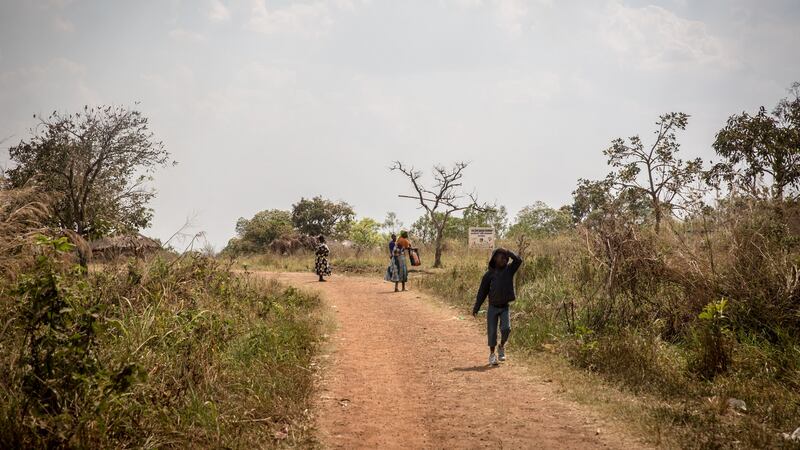 A boy walks home following the screening of the ICC verdict, in Dominic Ongwen’s home village of Coorom, northern Uganda. Photograph: Sally Hayden.
