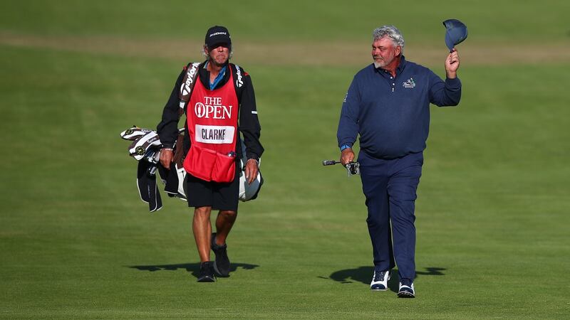 Darren Clarke salutes the crowd as he walks up to the 18th green. Photograph: Christopher Lee/Getty Images
