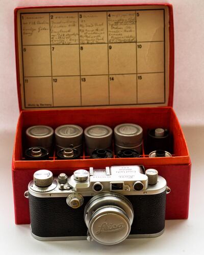 The Leica camera and film containers