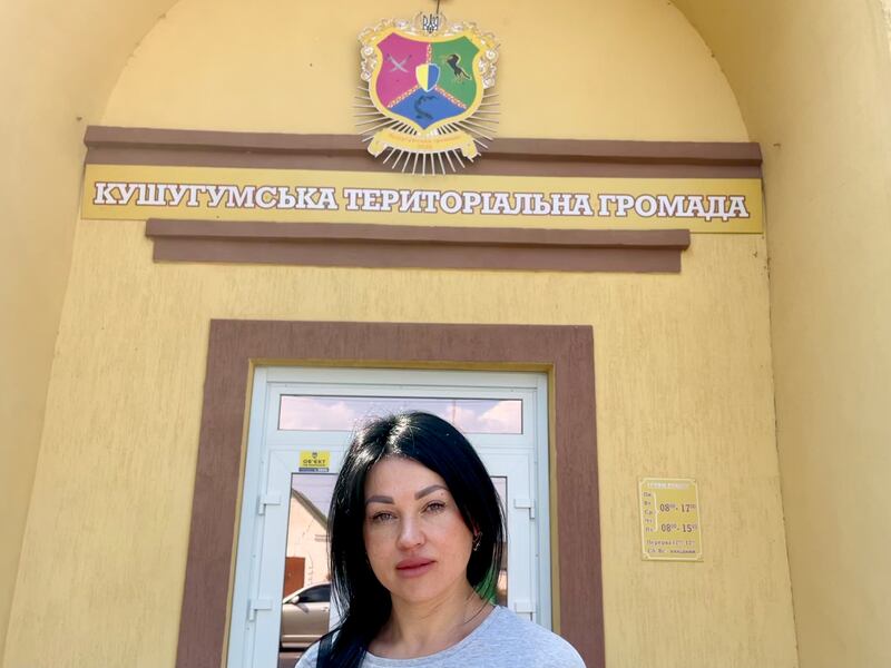 Viktoria Kryvenko, secretary of Kushuhum village council in southeastern Ukraine. The symbols on the district's crest – a prancing horse, crossed sabres and a sturgeon – reflect its Cossack history and its reliance on the Dnipro river. Photograph: Daniel McLaughlin