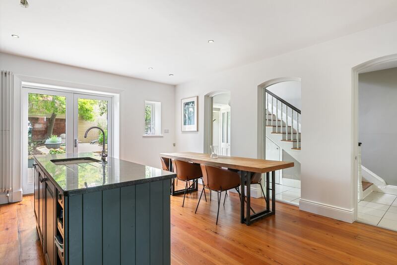 Kitchen island and dining area with glazed arches