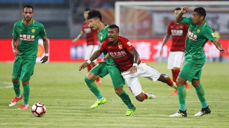 Ba Dun of Beijing Guoan and Paulinho  of Guangzhou Evergrande compete for the ball during the game at the  Beijing Workers Stadium. Photo:  VCG/VCG via Getty Images