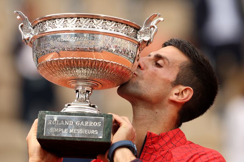 Novak Djokovic kisses the winners trophy after victory against Casper Ruud in the Men's Singles Final match of the 2023 French Open at Roland Garros. Photograph: Clive Brunskill/Getty Images