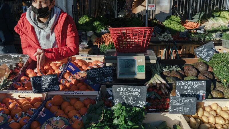 The Costaz stand at the Marché d’Aligre in Paris this week. The family has operated a greengrocer stand since 1905. Soaring inflation  is starting to squeeze shopkeepers and consumers. Photograph: Andrea Mantovani/The New York Times