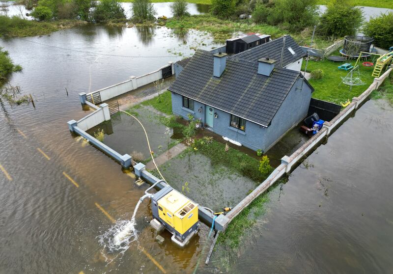 The family home of the McLoughlin family at near the village of Curraghboy, Carrick, Co Roscommon which is surrounded by water from a currently rising  overflow of Lough Funshinagh. Photograph: Alan Betson / The Irish Times

