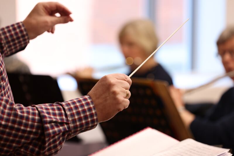 Sean Brennan conducts as the band rehearse  at CWU HQ, William Norton House, on Dublin’s North Circular Road. Photograph: Bryan O’Brien

