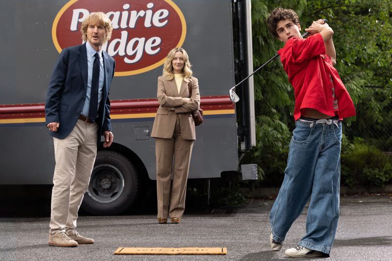 Owen Wilson, as Pryce Cahill, discovers 17-year-old golf prodigy Santiago Wheeler, played by Peter Dager. Photograph: Apple TV+. 