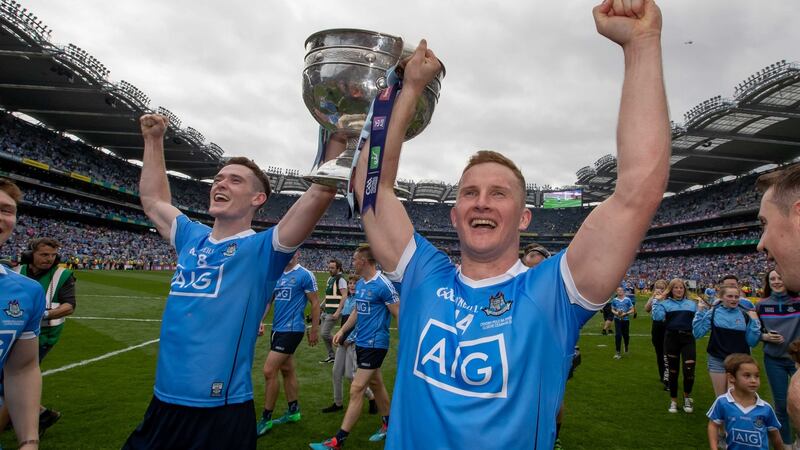 Dublin’s Brian Fenton and Ciaran Kilkenny celebrate with the Sam Maguire after beating Tyrone in the All-Ireland final. Photo: Morgan Treacy/Inpho