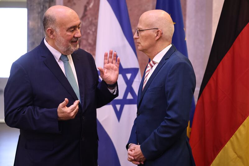 Ambassador of Israel to Germany Ron Prosor (left) and German Federal Council Bundesrat president Peter Tschentscher talk prior to a session and a commemoration ceremony for the victims of Hamas attack in Israel, at the German Federal Council in Berlin this week. 