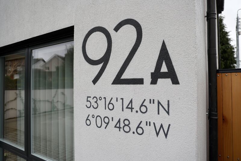 The house blends in with the street’s architecture but also stands out, thanks to the co-ordinates on the front of the house. Photograph: Nick Bradshaw