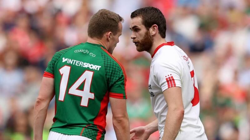 Tyrone’s Cathal McShane and Andy Moran of Mayo. Photo: Ryan Byrne/Inpho