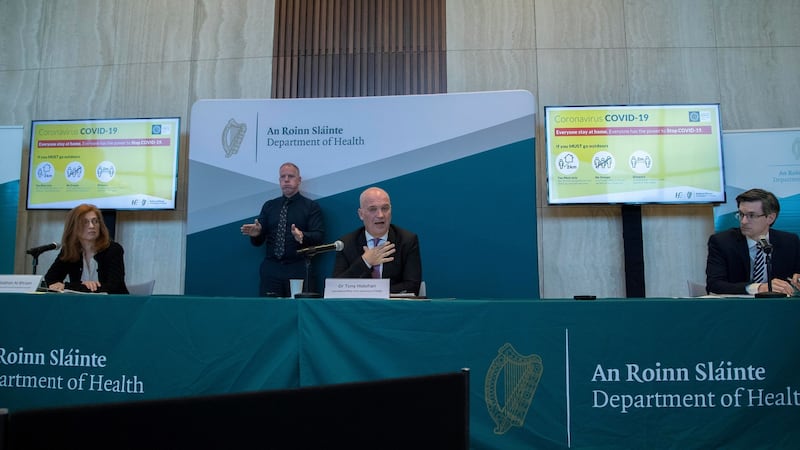 Sign language interpreter Michael Feeney at a Covid-19 press briefing with Dr Tony Holohan, chief medical officer at the Department of Health, Dr Ronan Glynn, deputy chief medical officer, and Dr Siobhán Ni Bhriain, HSE integrated care lead. Photograph: Colin Keegan/Collins
