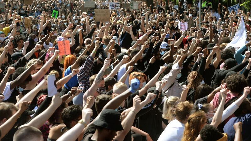 Supporters attend a rally in solidarity with the Black Lives Matter campaign outside the American embassy in  Dublin. Photograph: Dara Mac Dónaill/The Irish Times