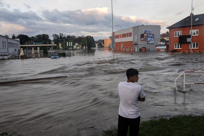 A man looks at a flooded street on September 15th Opava, Czech Republic. Photograph: Michal Cizek/AFP via Getty Images