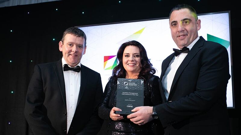 Sinead Leonard, Business Unit Director, CBRE presents the Facilities Management CSR Initiative of the Year award to Peter Morhan & Brian Kearney, AbbVie Evergreen.