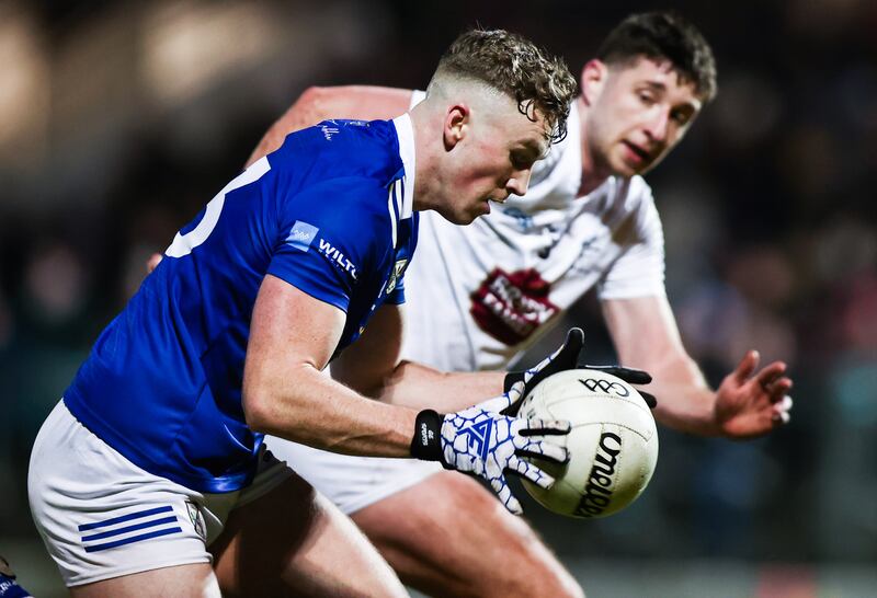 Cavan's Paddy Lynch is challenged by Shea Ryan of Kildare. Photograph: Tom Maher/Inpho