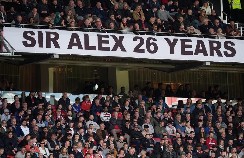 A banner supporting former Manchester United manager Alex Ferguson after the termination of his ambassadorial contract with the club. Photograph: Martin Rickett/PA