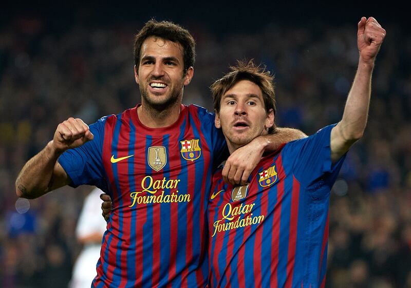 Lionel Messi, right. of Barcelona celebrates with Cesc Fabregas after scoring against AC Milan in the Champions League in 2012. Photograph: Manuel Queimadelos Alonso/Getty