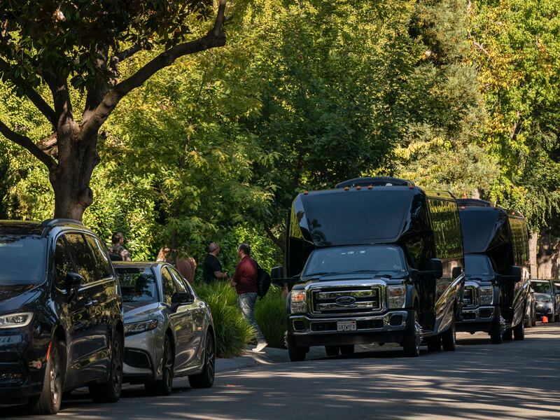 Passenger vans drop off guests for a private event at a house owned by Mark Zuckerberg in Palo Alto. Photograph: Elliott/The New York Times
                      