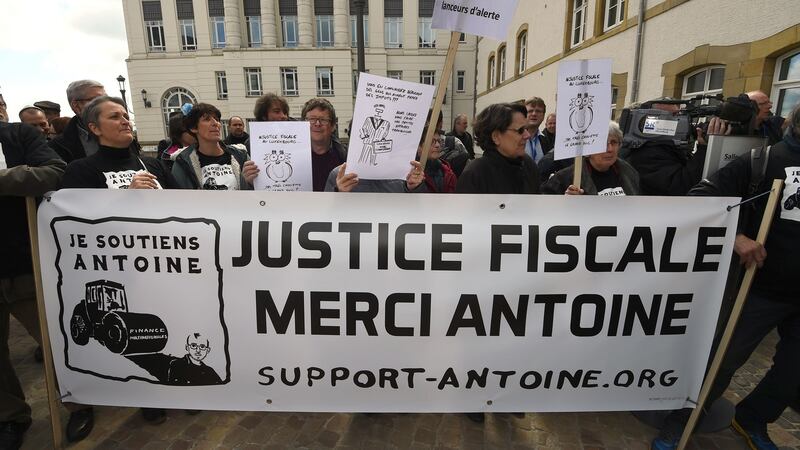 Supporters of Antoine Deltour and Raphael Halet, two former employees at services firm PricewaterhouseCoopers (PwC), and French journalist Edouard Perrin who ace charges over the theft of thousands of confidential files in the LuxLeaks scandal. Around 50 supporters shouted “Thank you, Antoine, thank you Antoine!” as the defendants arrived at the courtroom in Luxembourg for the start of the trial, which is expected to last until May 4th.  Photograph: John Thysjohnthys/AFP/Getty Images