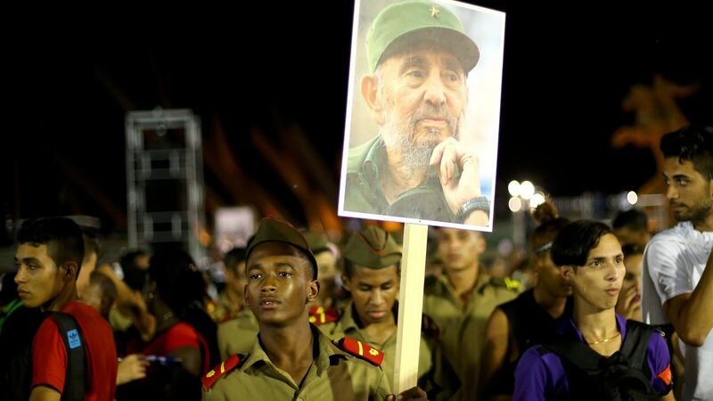 A cadet carries an image of former Cuban leader Fidel Castro at a tribute to Castro in Santiago de Cuba. Photograph: Ivan Alvarado/Reuters.