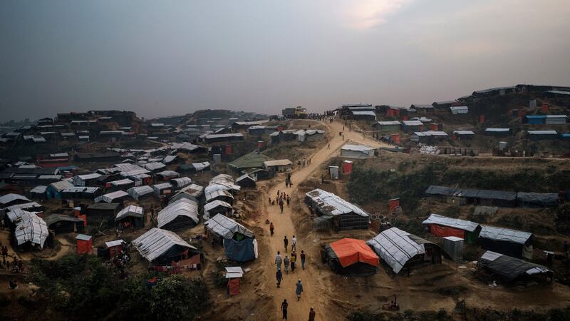 Rohingya refugees walk through the Kutupalong refugee camp in Cox’s Bazar, Bangladesh, in  November 2017. Photograph: Adam Dean/New York Times