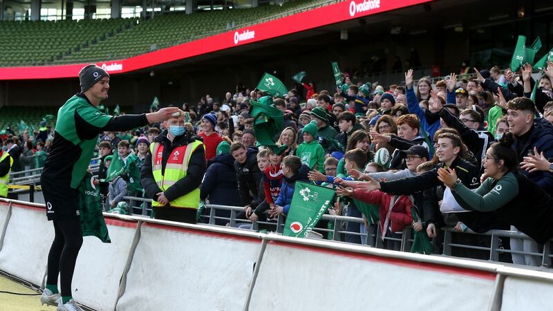 Johnny Sexton throws a jersey to fans during Ireland’s Open Training day at the Aviva Stadium. Photograph: Tom Maher/Inpho