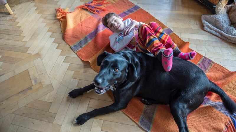 Siobhan with her family dog Charlie at their home in Fethard-on-Sea. Photograph: Brenda Fitzsimons