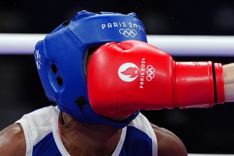 Kellie Harrington lands a blow on Angie Paola Valdes Pana in their quarter-final. Photograph: Peter Byrne/PA Wire.
