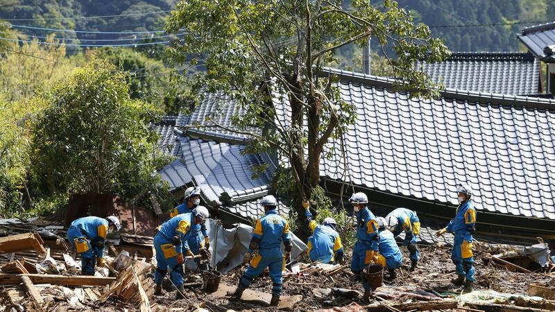 Police officers conduct a search operation near the damaged houses in Minamiaso, Kumamoto prefecture, southern Japan on Saturday. Photograph: Shohei Miyano/Kyodo News via AP
