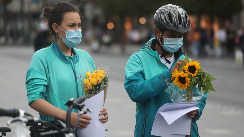 Deliveroo riders and cyclists hold a vigil on O’Connell Street in Dublin for Thiago Cortes (28). Photograph: Niall Carson/PA Wire