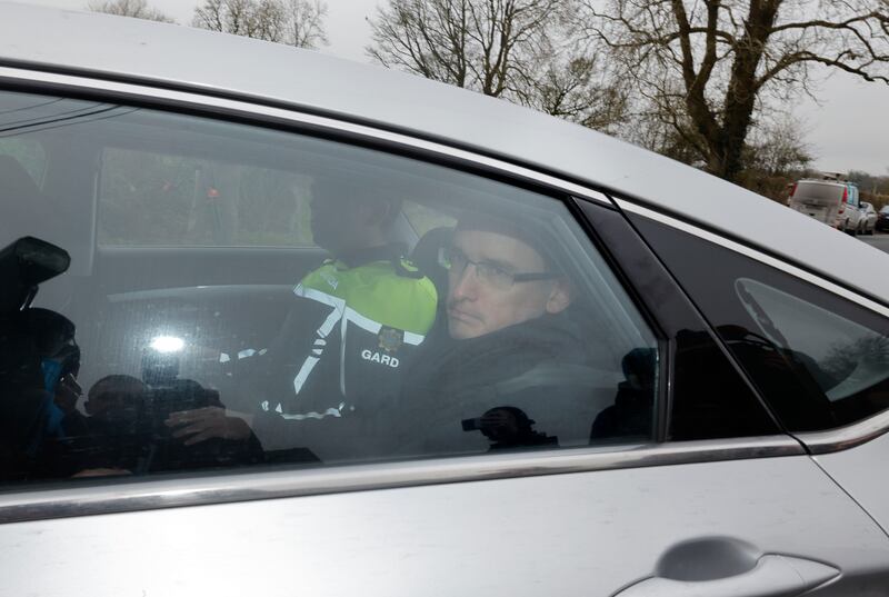 Enoch Burke is driven away from Wilson’s Hospital School near Multyfarnham in a Garda car on Tuesday afternoon. Photograph: Alan Betson