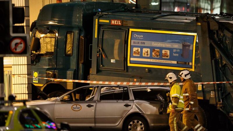 Emergency workers at the scene of the fatal  accident in George Square in Glasgow, Scotland on Monday. Photograph: EPA