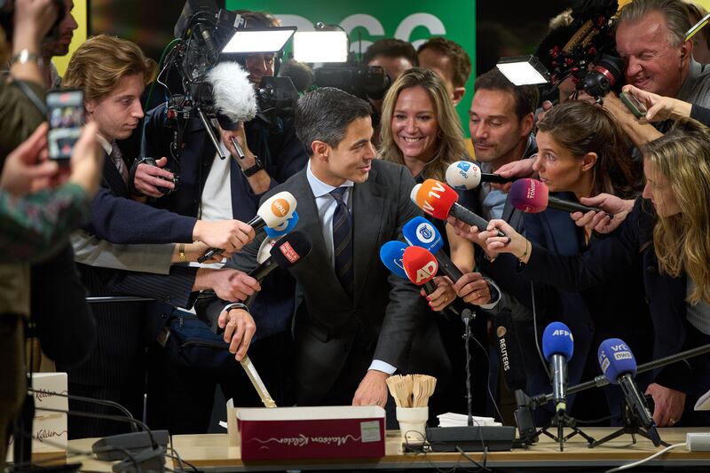Rob Jetten cuts a pie in celebration of D66’s election results. Photograph: AP Photo/ Peter Dejong