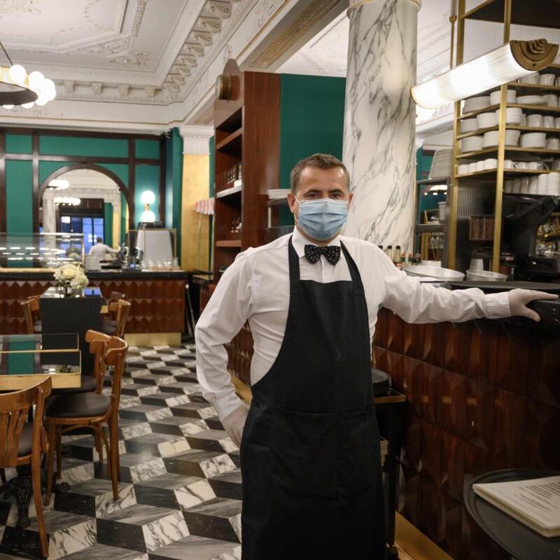New normal: face masks will be a common sight. Photograph: Fabrice Coffrini/AFP via Getty