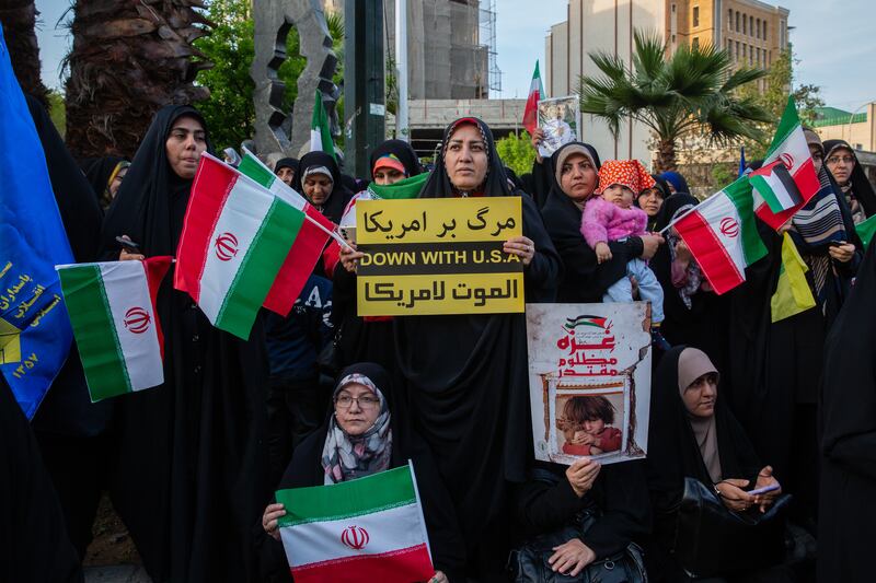 Demonstrators show their support for Iran’s attack on Israel in Palestine Square in Tehran, Iran. Photograph: Arash Khamooshi/New York Times
                      
