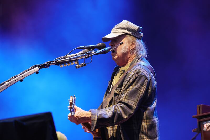 Neil Young on stage at Malahide Castle playing his set after Van Morrison. Photograph: Alan Betson/The Irish Times

