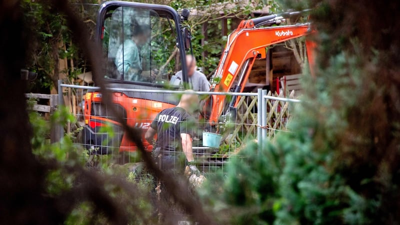 Police officers search a garden allotment in the northern German city of Hanover on Tuesday. Photograph: Hauke-Christian Dittrich/AFP via Getty Images