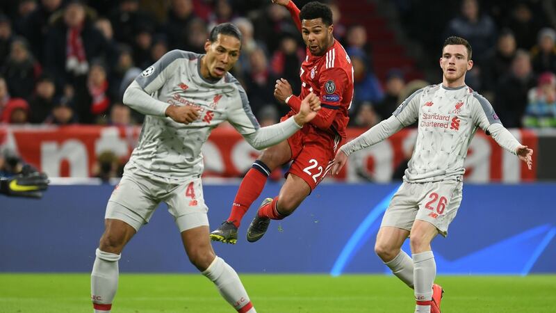 Van Dijk tackles Serge Gnabry. Photo: Christof Stache/Getty Images