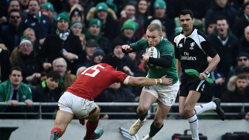Keith Earls takes on Leigh Halfpenny at the Aviva. Photograph: Charles McQuillan/Getty
