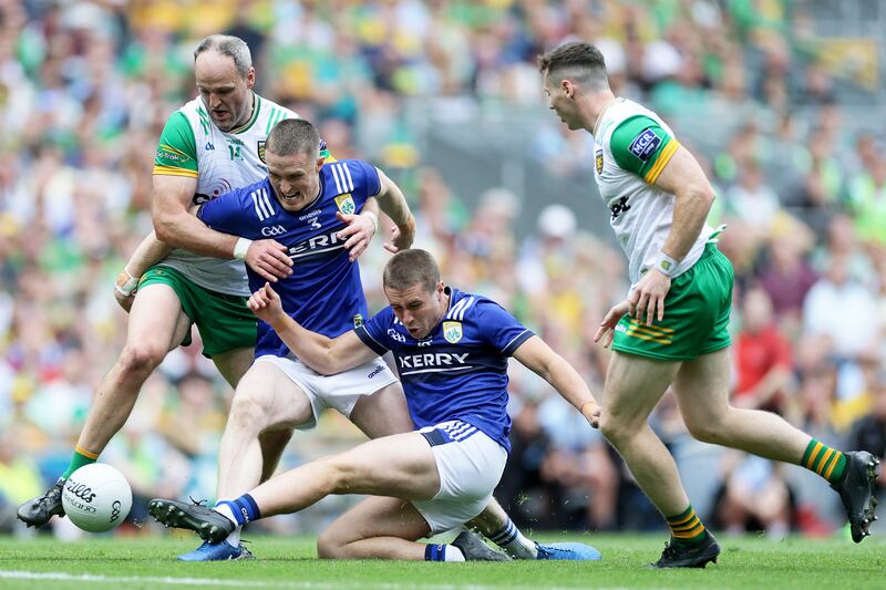 Kerry's Evan Looney and Jason Foley compete for possession with Michael Murphy of Donegal. Photograph: Laszlo Geczo/Inpho