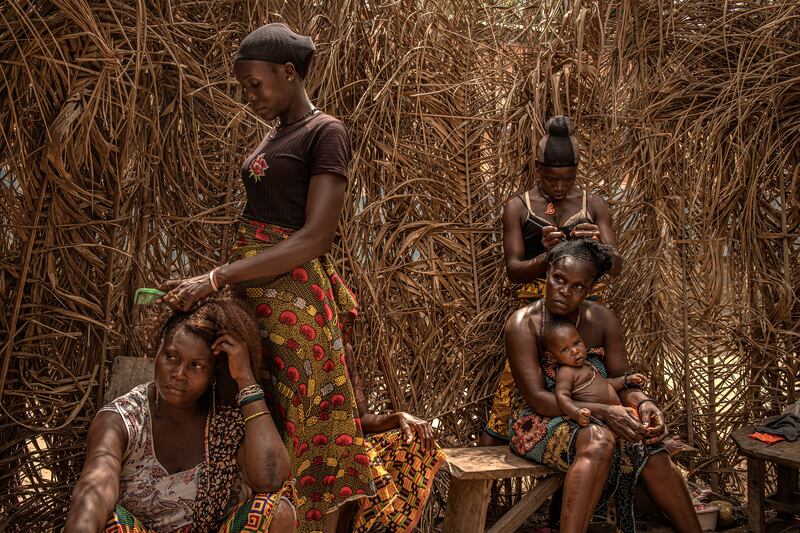 Hair care in the village of Fonkoye, Sierra Leone.