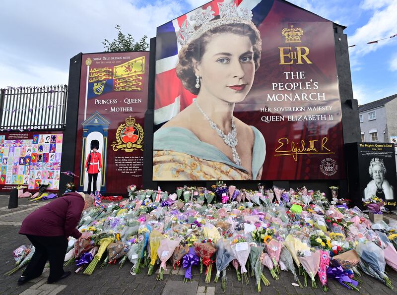Pacemaker Press 09/09/22
Members of the public pay tribute on the Shankill Road in Belfast following the death of Queen Elizabeth II, the UK's longest-serving monarch, who has died at Balmoral aged 96, after reigning for 70 years.
Pic Colm Lenaghan/Pacemaker